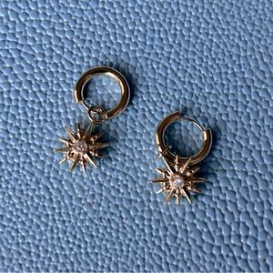 Kendra Scott starburst huggy earrings in gold with silver rhinestone